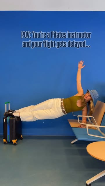 Side plank on airport chairs while waiting for a delayed flight